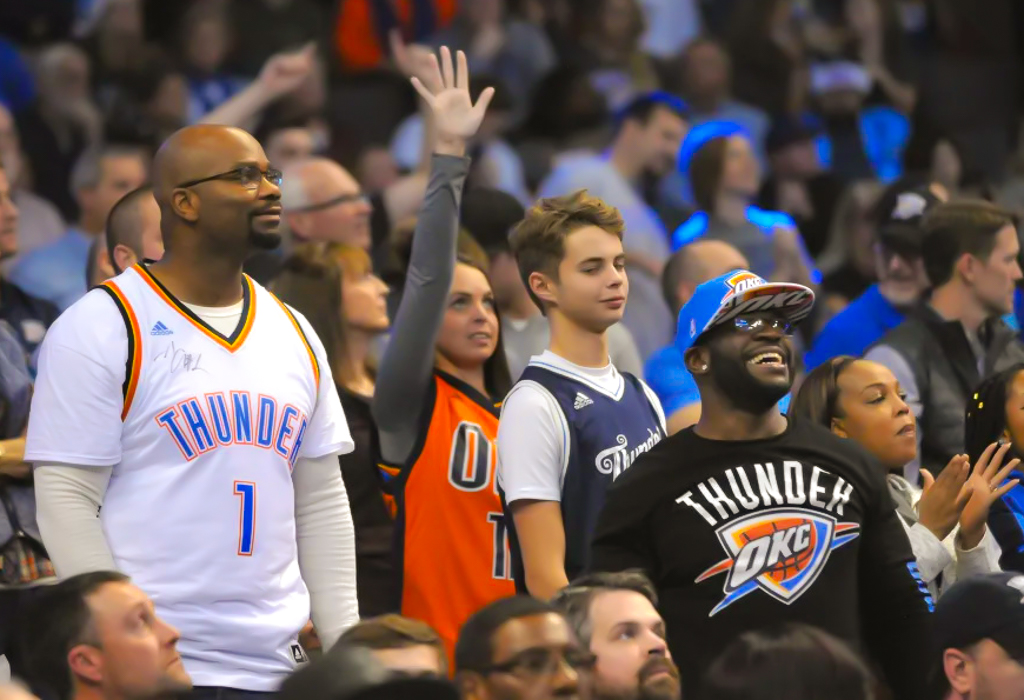 Demarchoe Carpenter, left, and Malcolm Scott during a timeout at an Oklahoma City Thunder game in 2023. Image by Michael Downes/The Frontier